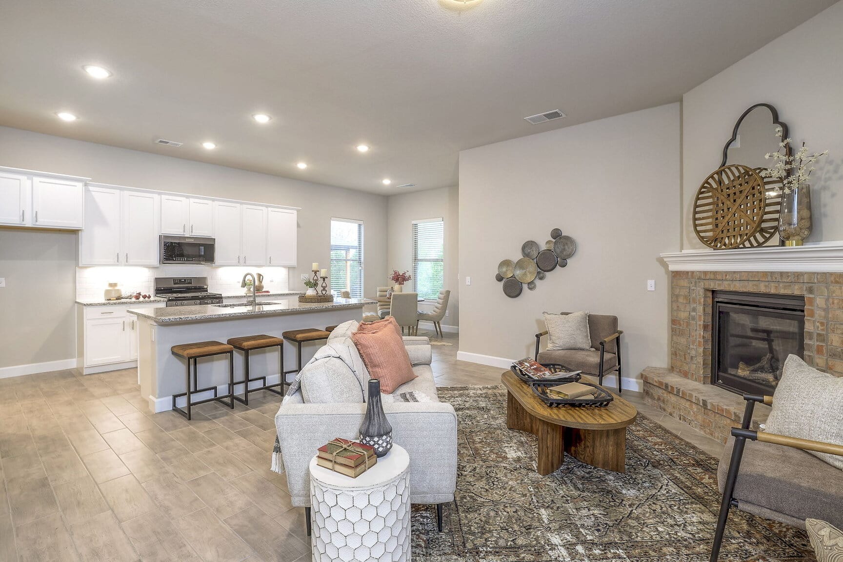 Open concept living room with vaulted ceilings and fireplace